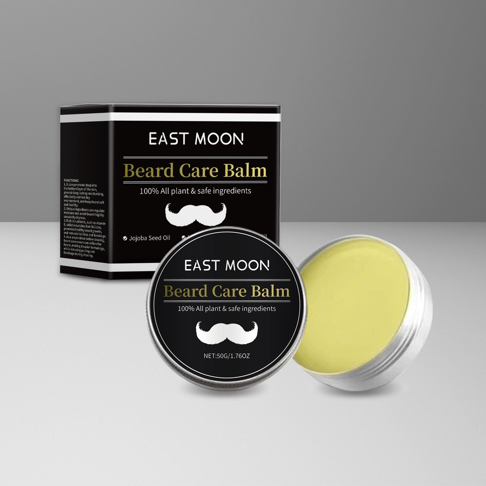 A tin of East Moon Beard Care Balm with its black and white packaging box, alongside an open silver tin showing the pale yellow balm inside, set against a neutral gray background.