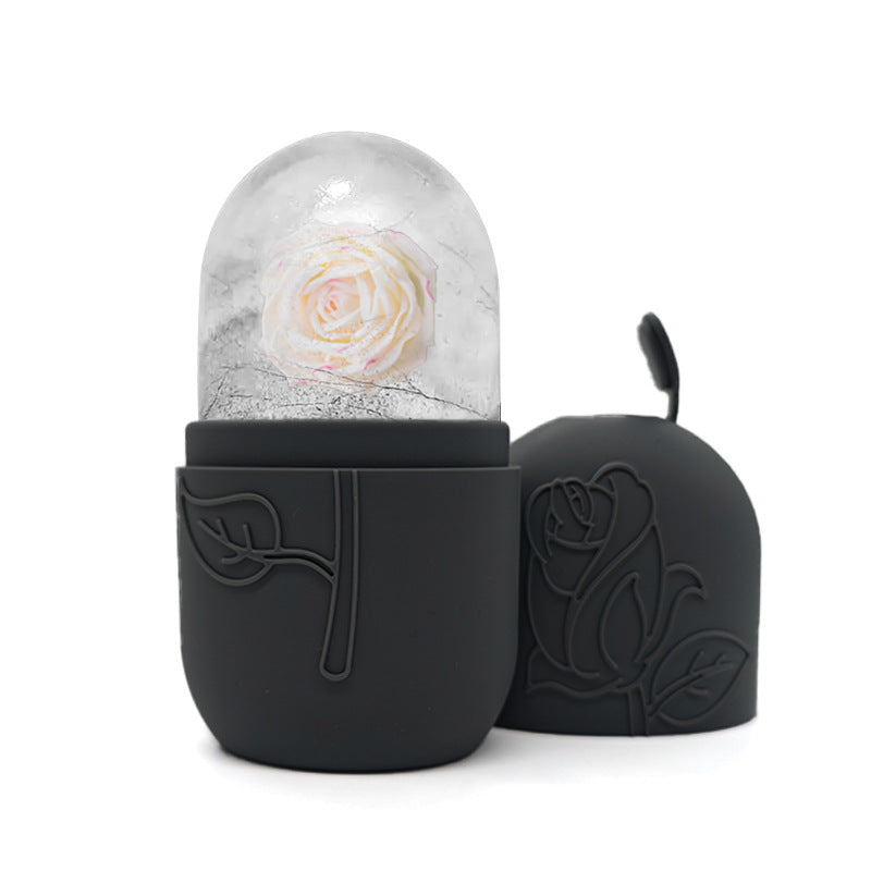 Black decorative container with a white rose inside on a white background