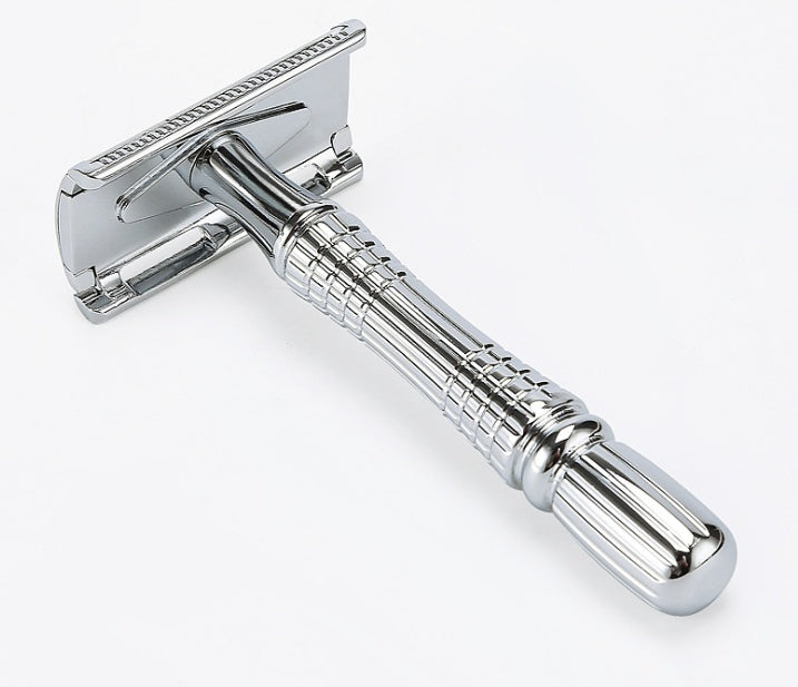 Chrome safety razor on a white background