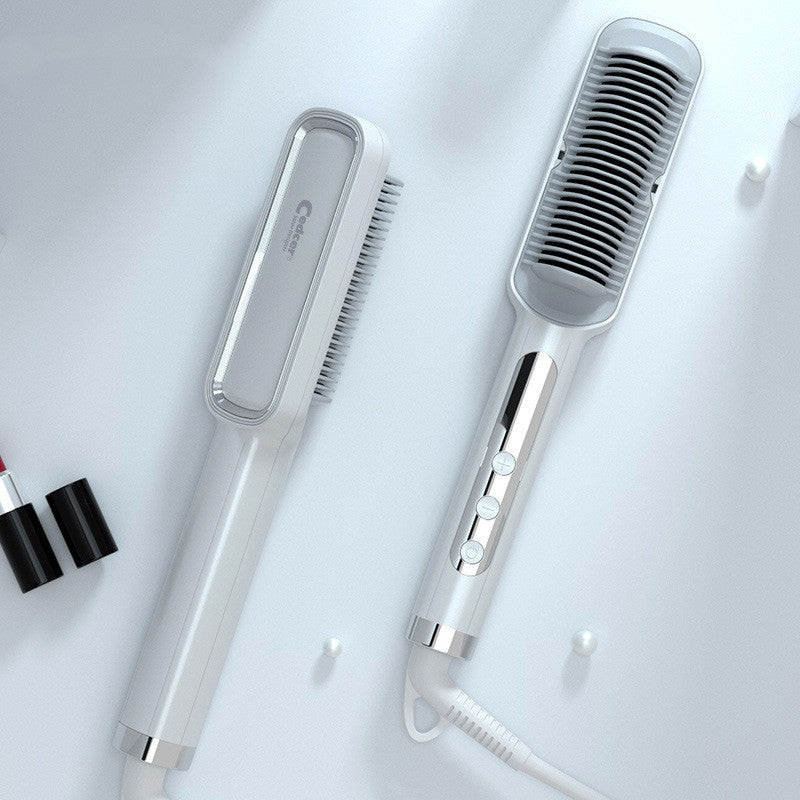 Hair straightener and brush on a white background