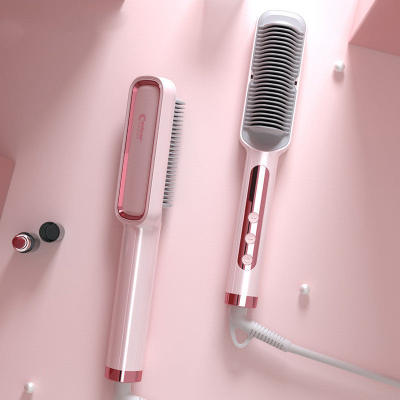 Hair straightener and comb on a pink background