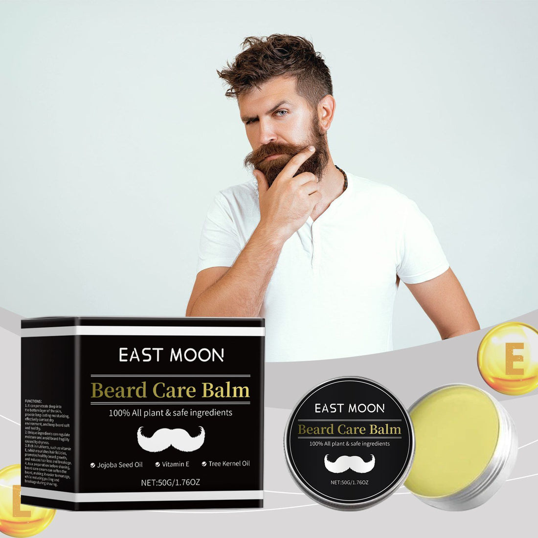 Man with a beard holding his chin next to East Moon beard care balm packaging on a white background
