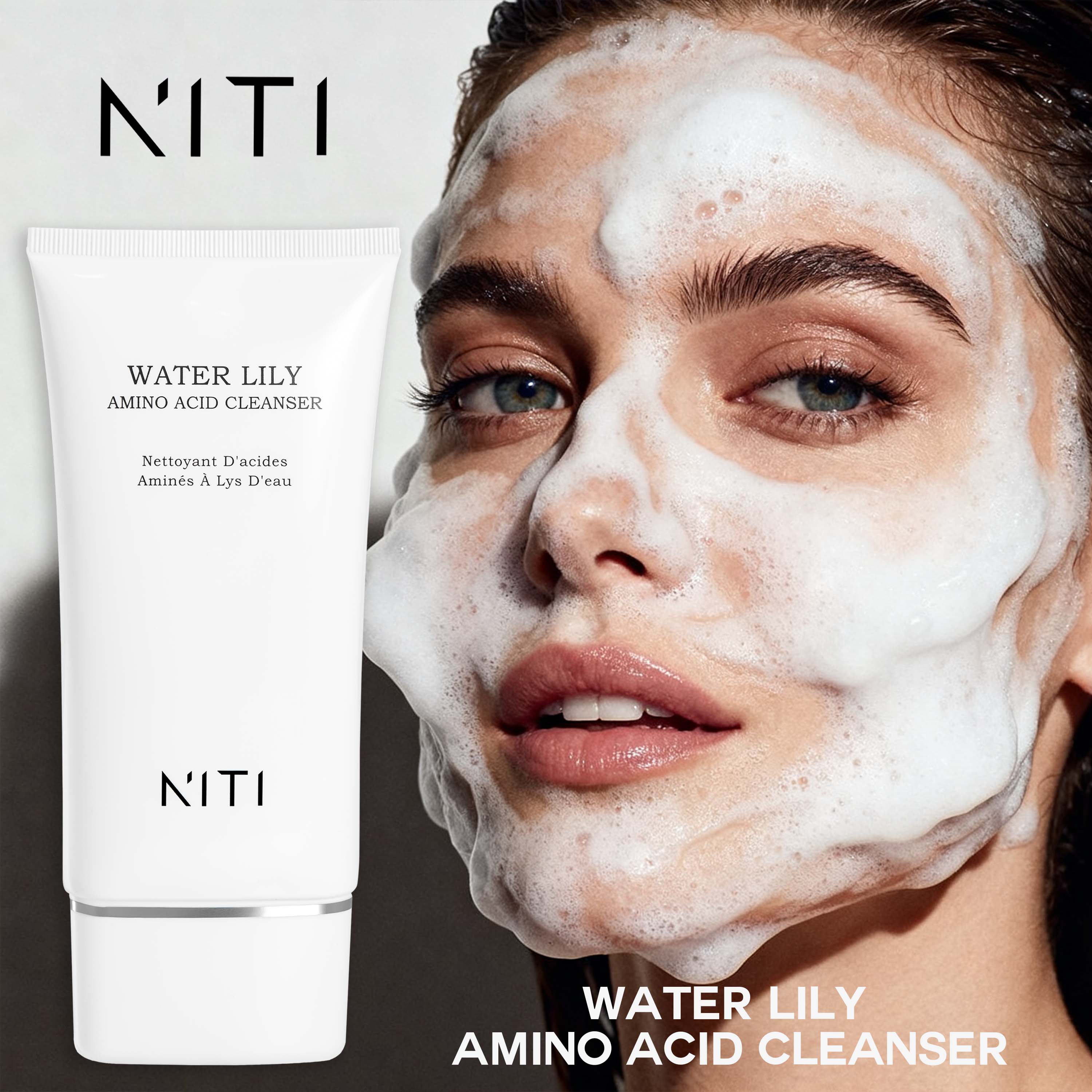 NITI Water Lily Amino Acid Cleanser shown in a white squeeze tube next to a model with a thick lather of cleansing foam on their face.