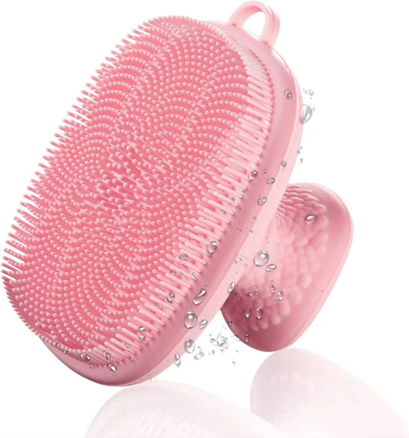 Pink silicone scrubber with bristles on a white background