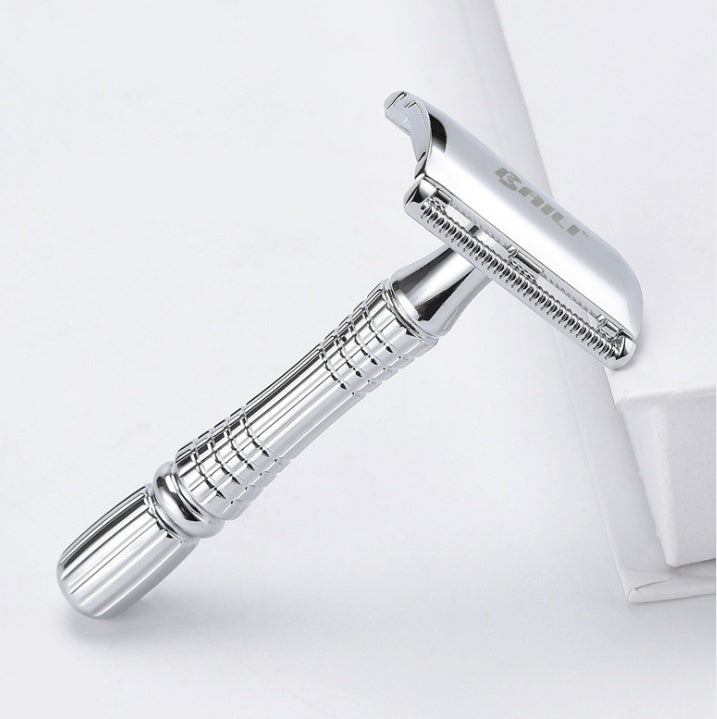 Silver safety razor on a white background