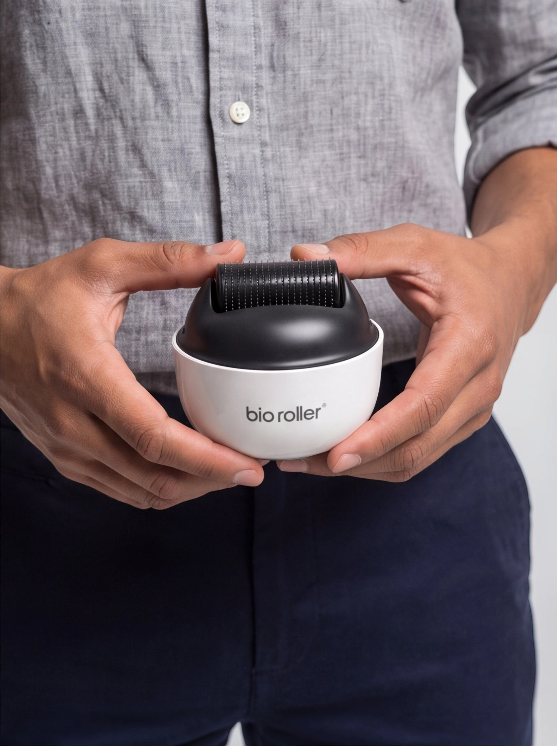 TheGromify titanium beard growth derma roller with 540 needles held in hands for grooming and follicle stimulation