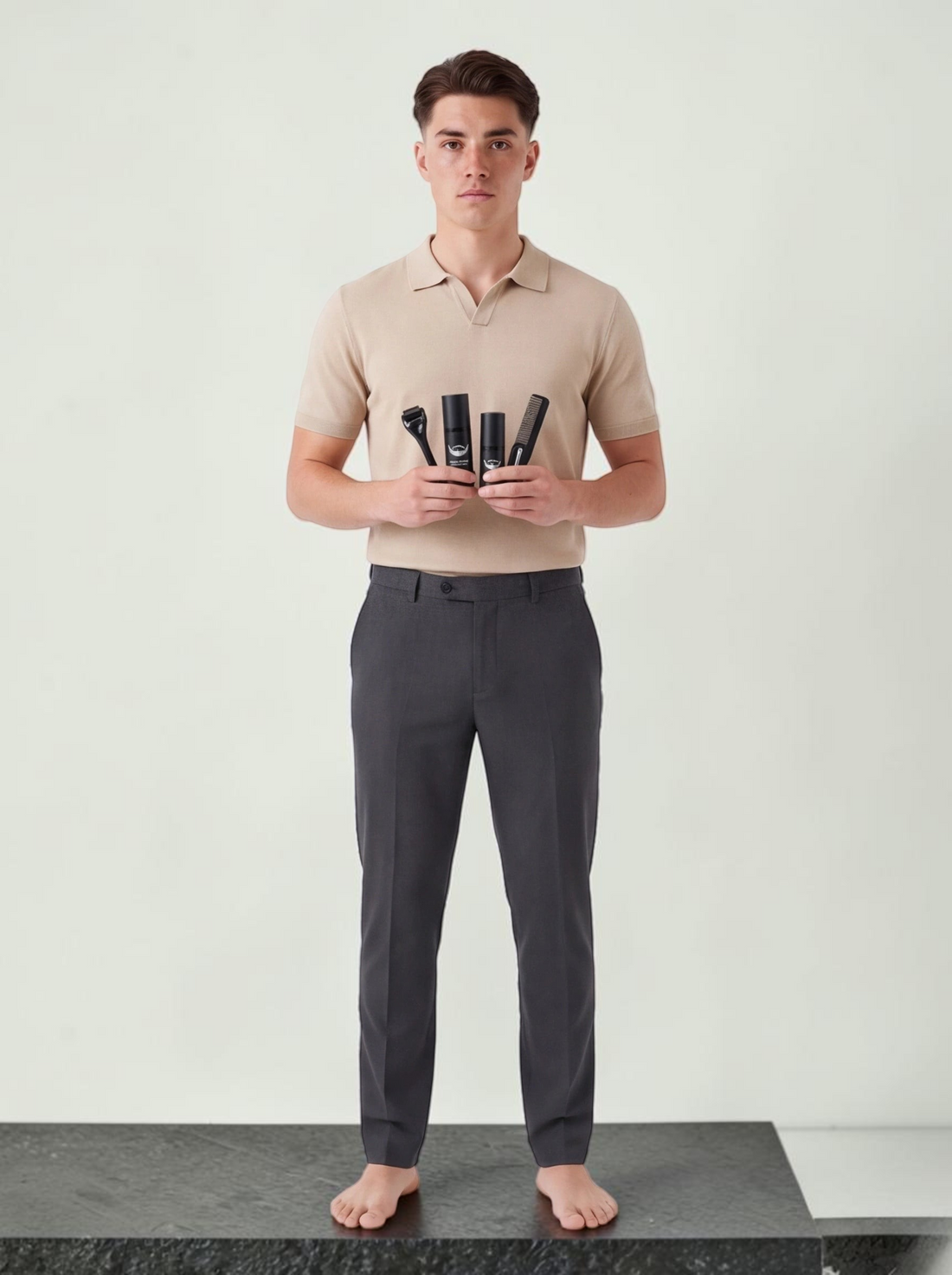 TheGromify beard growth roller kit held by a man in a beige polo shirt, featuring microneedle roller and disinfectant.