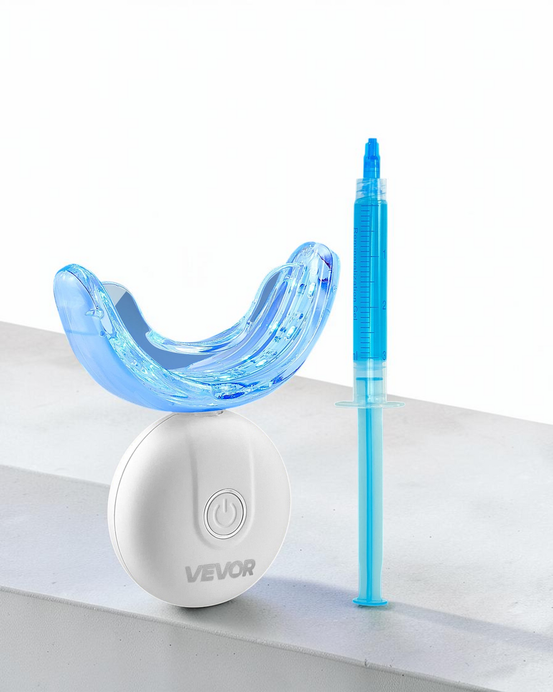 TheGromify 32-LED teeth whitening kit with a blue light tray, wireless power base, and whitening gel syringe.