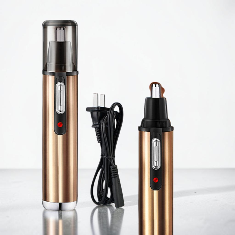 TheGromify electric nose and ear hair trimmer set in metallic bronze with a charging cable on a white surface.