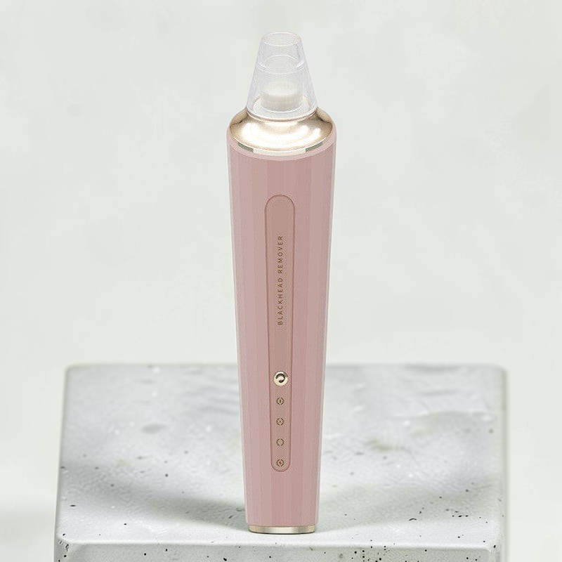 TheGromify electric pore vacuum in dusty pink with gold accents for gentle blackhead removal and skin cleansing