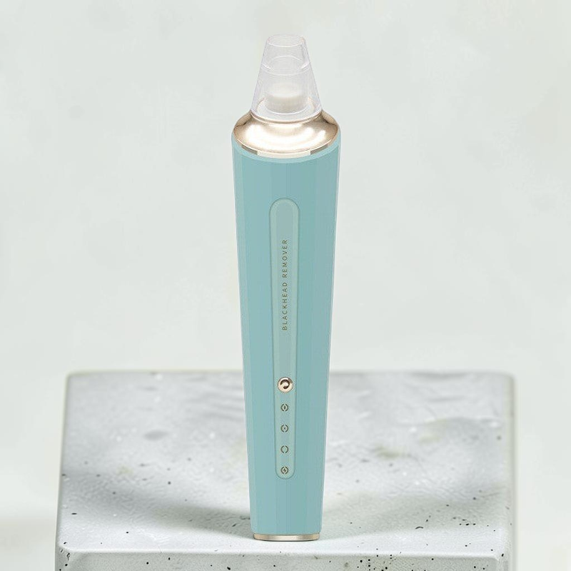 TheGromify electric pore vacuum in teal with gold accents, featuring three adjustable suction levels for blackheads.