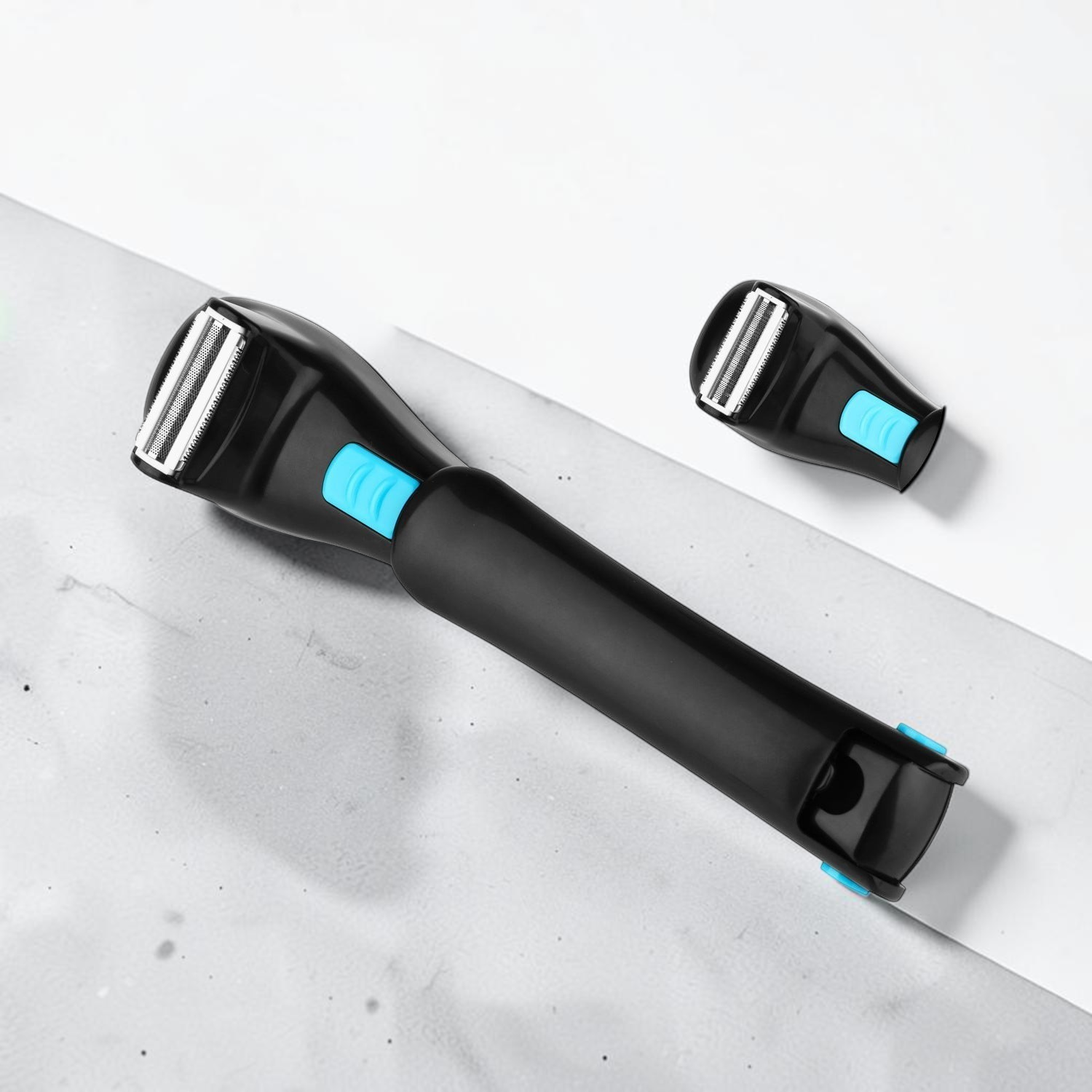 TheGromify long-handle back hair shaver with a foldable black ergonomic design and blue accent buttons.
