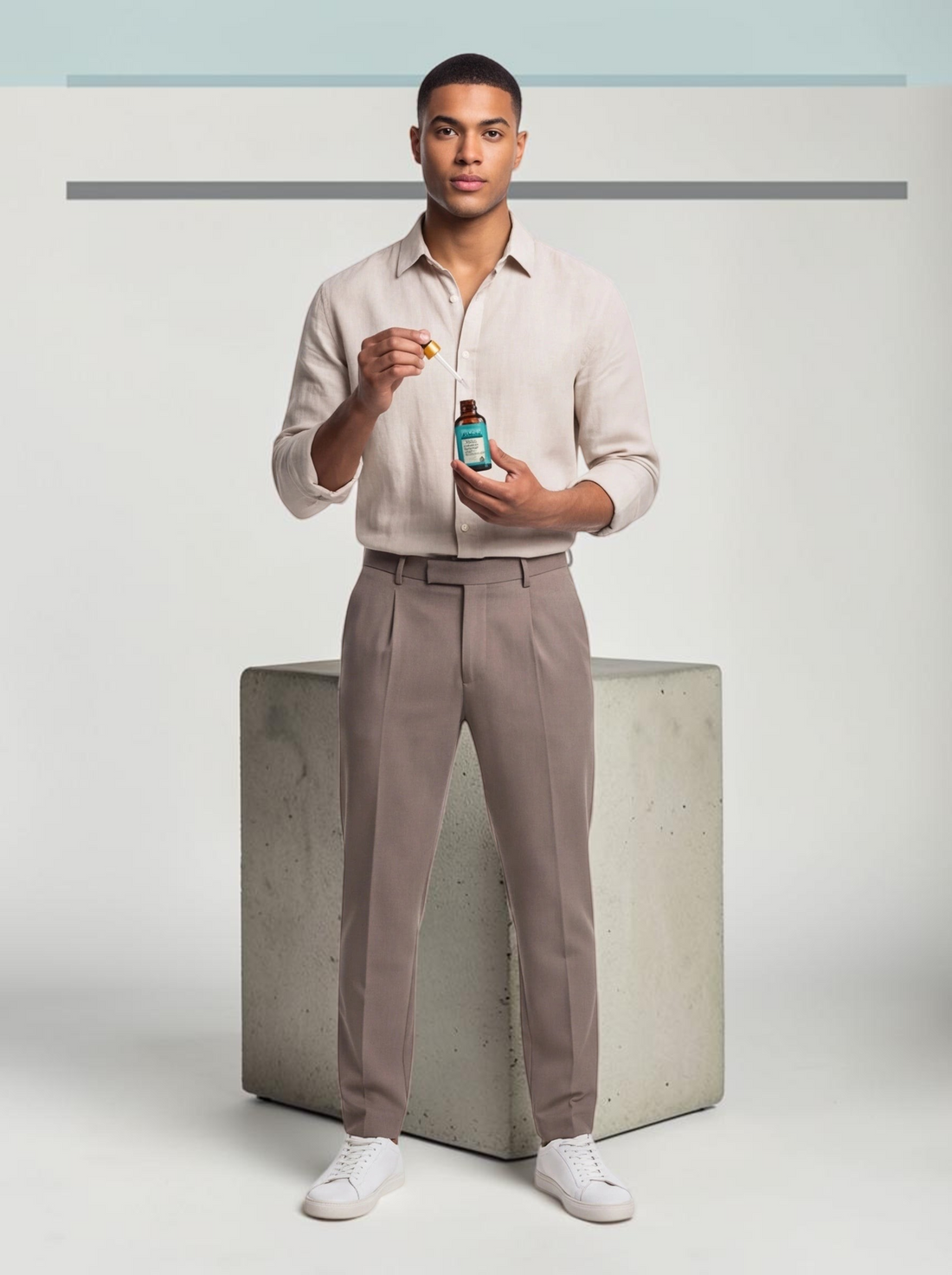 TheGromify Ginger & Rosemary Hair Growth Serum held by a man in a linen shirt, promoting scalp health and hair growth.