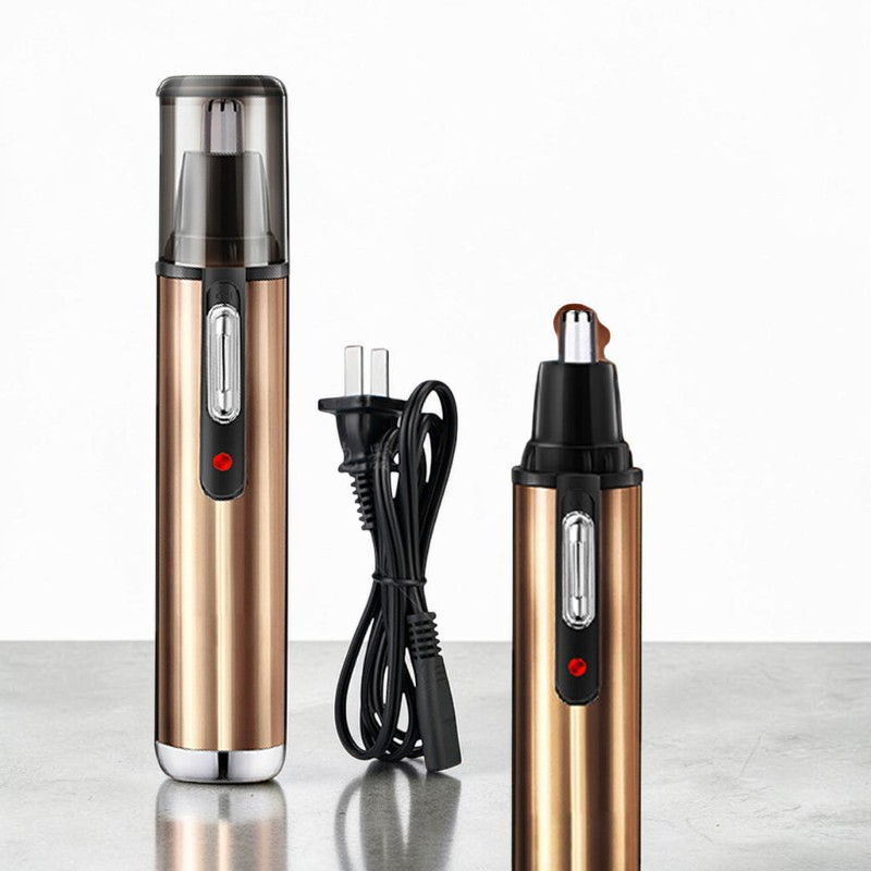 TheGromify electric nose and ear hair trimmer in gold with a rotary dual-blade system and USB charging cable.
