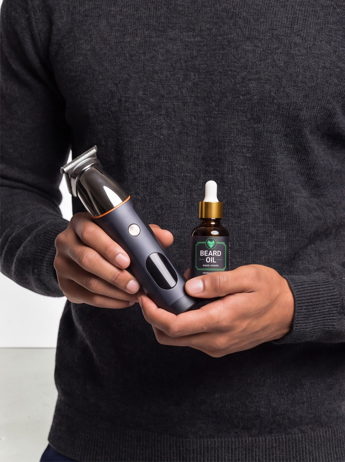 TheGromify grooming kit featuring a matte black waterproof trimmer and a bottle of sandalwood and jojoba beard oil.