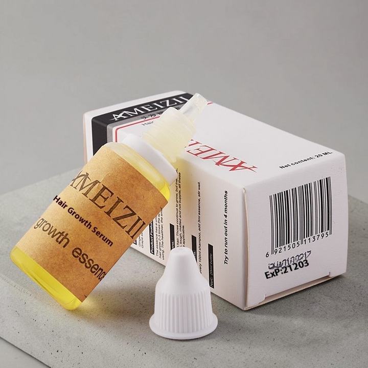 TheGromify Hair Growth Accelerator Tonic bottle and packaging box on a grey surface