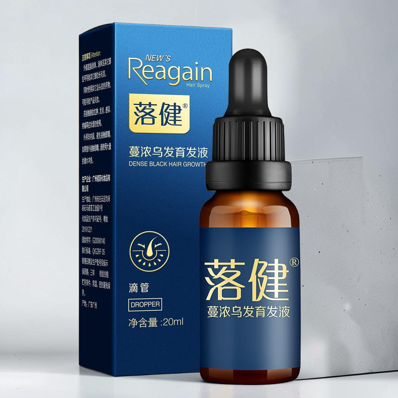 TheGromify Hairline Strengthening Lotion in an amber glass dropper bottle with its blue product packaging box.