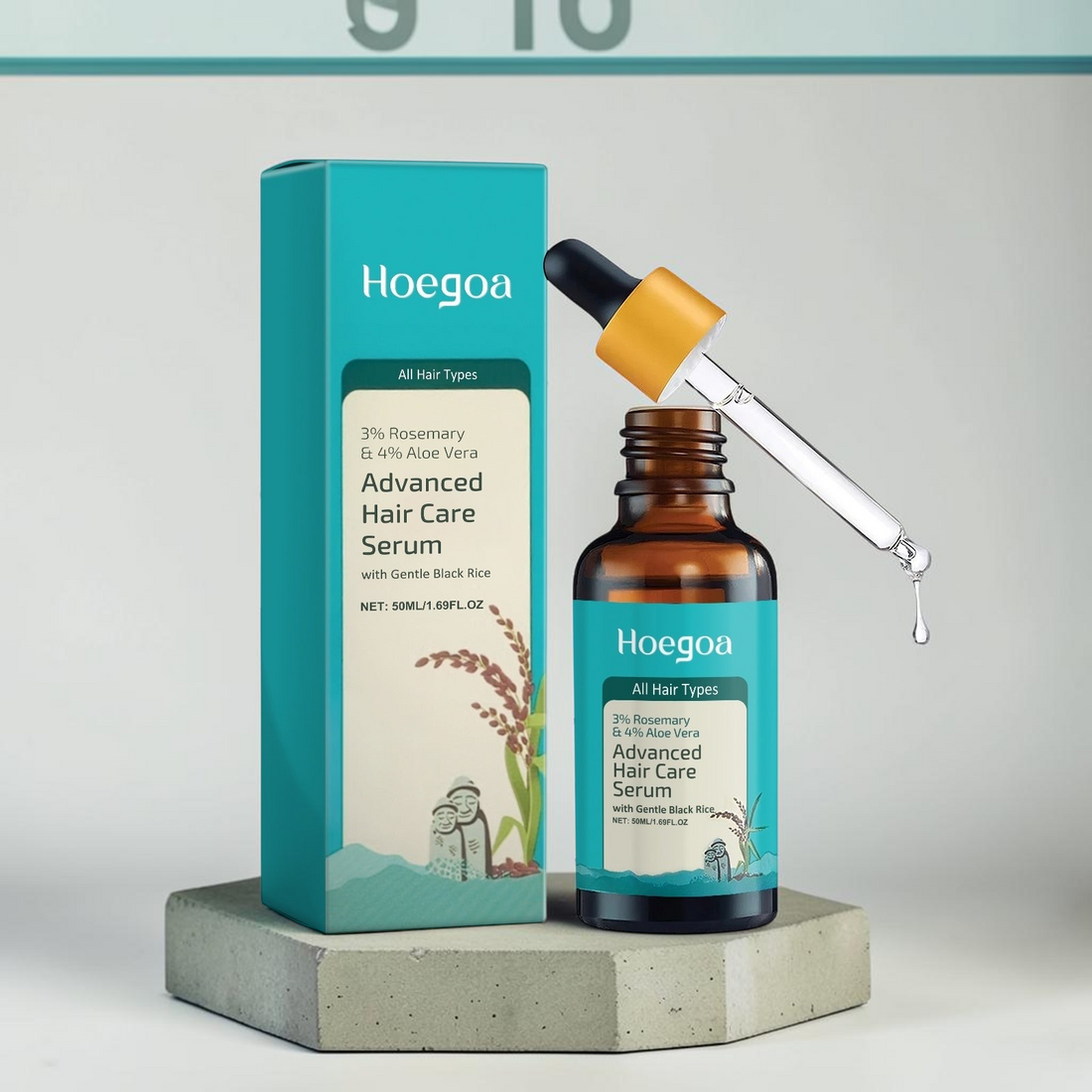 TheGromify Hoegoa rosemary and aloe vera hair growth serum bottle and box on a concrete stand.