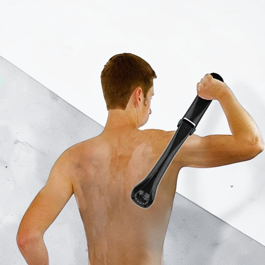 TheGromify long-handle back hair shaver being used by a man to groom his back with the ergonomic folding tool