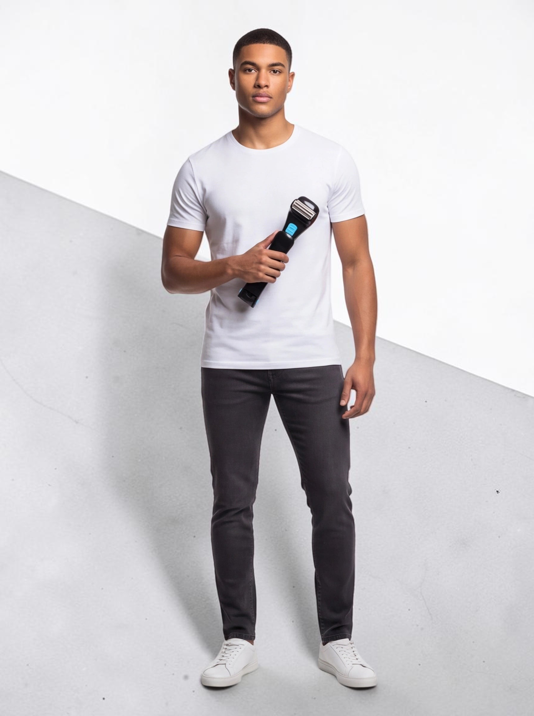A man holding a black TheGromify long-handle back hair shaver with a foldable design against a white background.