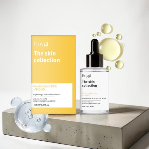 TheGromify skincare set featuring a yellow box and a glass dropper bottle of Niacinamide brightening face serum.