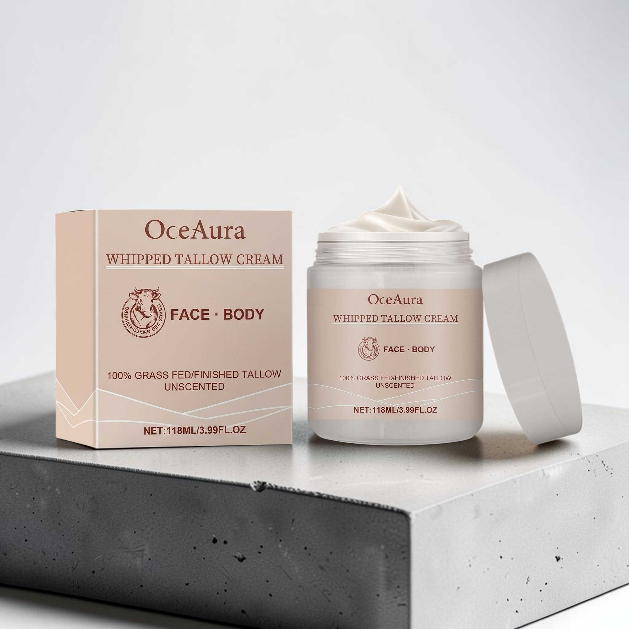 TheGromify OceaAura whipped tallow face and body moisturiser in a jar and box on a grey concrete block.