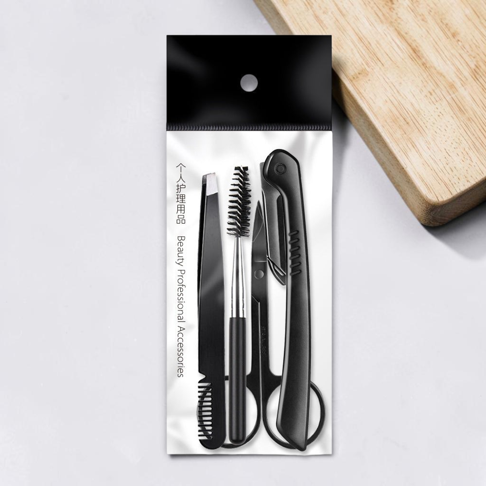 TheGromify precision eyebrow grooming kit featuring black stainless steel tweezers, scissors, and a brow brush in a case