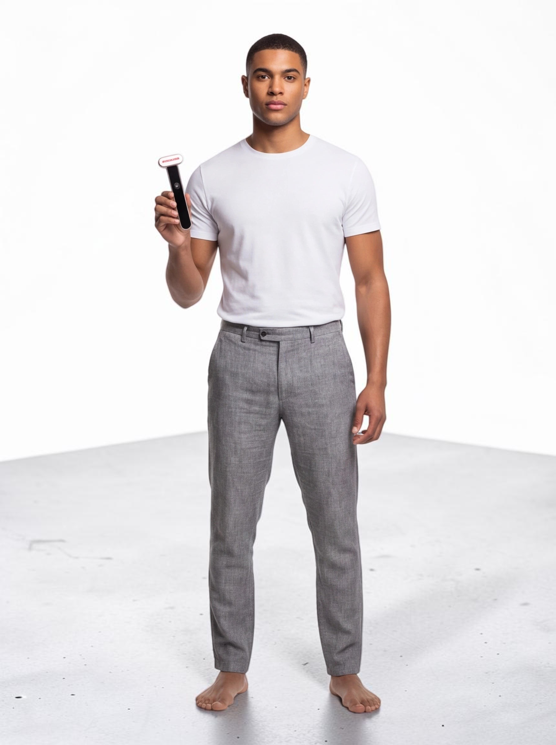 TheGromify 3-in-1 red light facial wand held by a man in a white t-shirt and grey trousers against a white background
