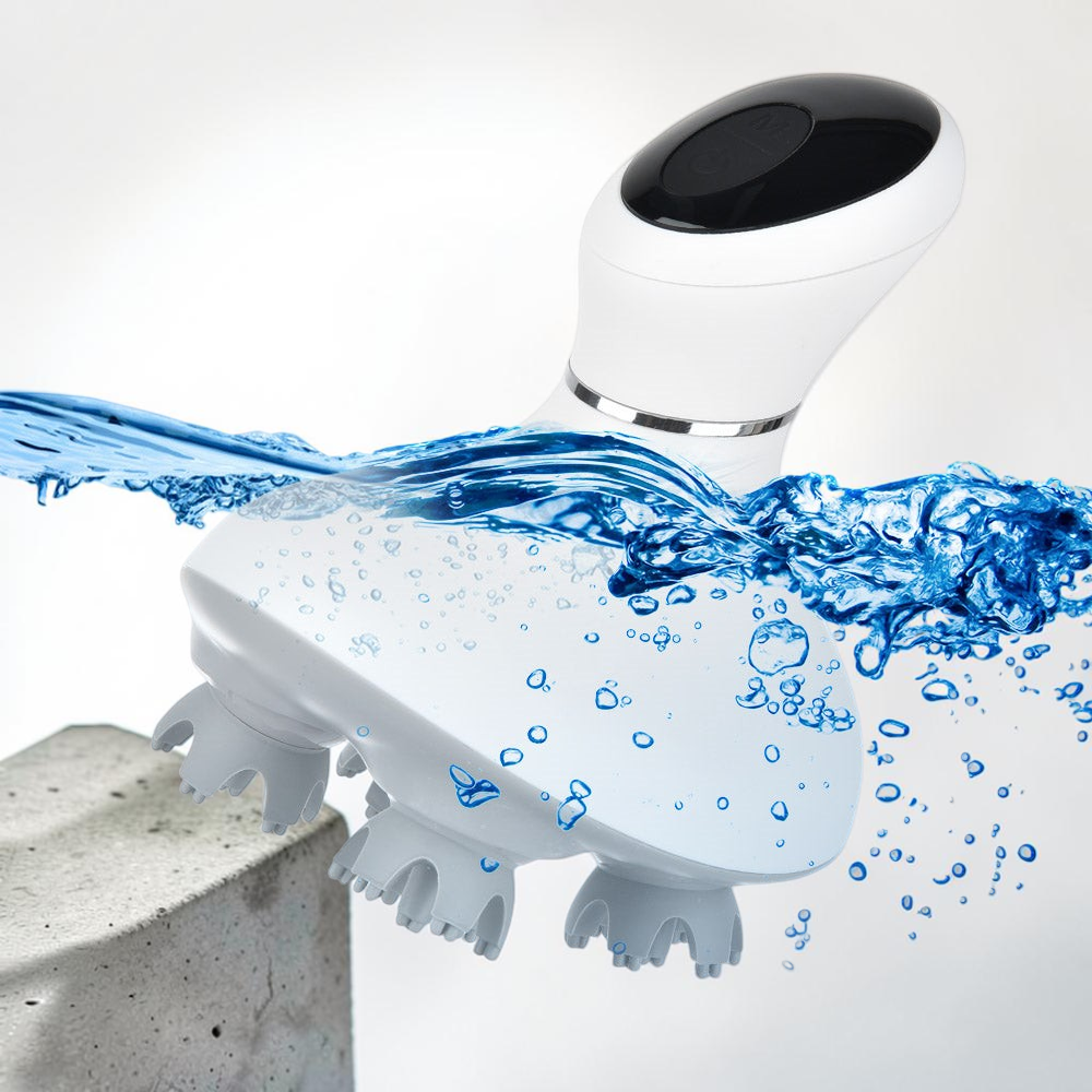 TheGromify wireless electric scalp massager with 3D kneading nodes shown splashing in water to highlight waterproof design