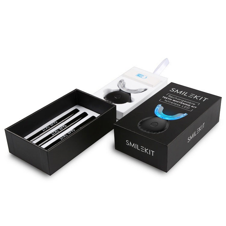 TheGromify wireless LED teeth whitening kit with black packaging, whitening pens, and a blue light silicone tray.