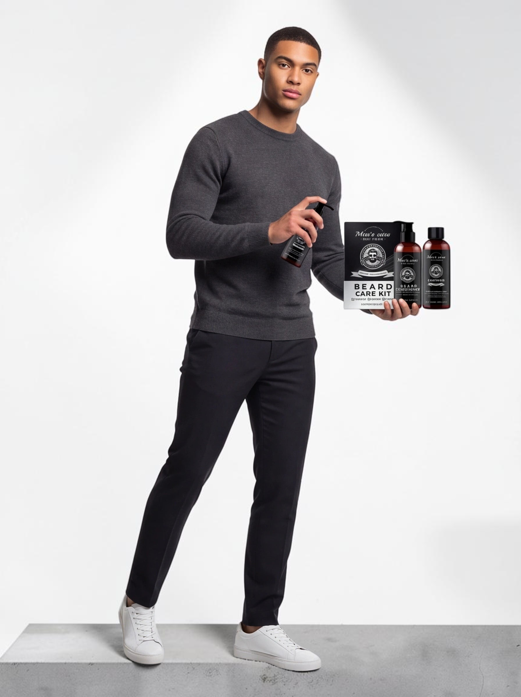 TheGromify Argan beard wash and conditioner set held by a man in a grey sweater for complete beard care routine.